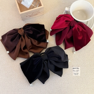 Detailed set of three velvet bow hair clips in black, burgundy and brown with pearls