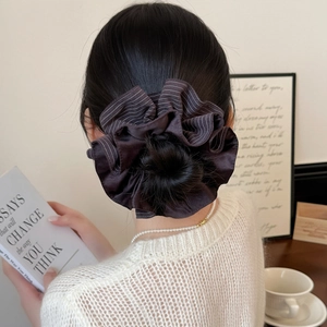 Retro striped large scrunchie for hair buns featuring a dark brown satin texture