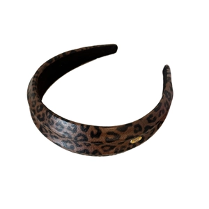 Leopard print leather headband with handmade gold label and textured rib design