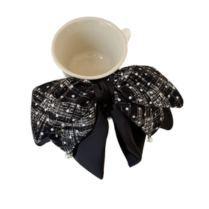 Elegant oversized black and white tweed bow hair claw clip with pearls and ribbon