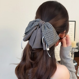 Maillard plaid bow hair claw clip with pearl pendant on model for autumn winter