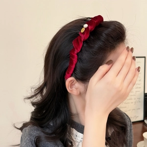Elegant burgundy velvet headband with pearl accent and gold logo for winter hair styling