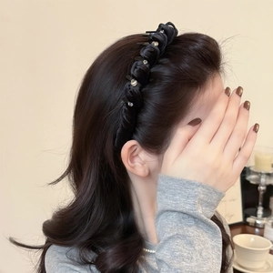 Elegant black velvet twisted headband with rhinestone clips for voluminous hair styling