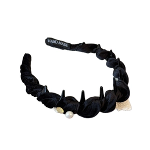 Elegant velvet braided headband with pearls and gold emblem for high top hair styling