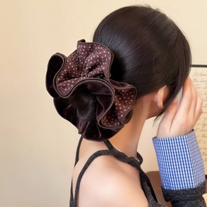 Brown velvet floral scrunchie for women with layered pleats shown on a low ponytail
