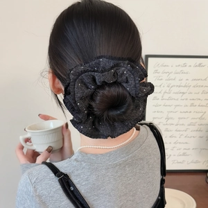 Elegant double-layered black polka dot knitted scrunchie with ruffled lace on model