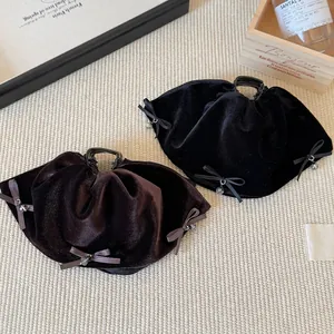 Elegant velvet bow hair claw clips in black and coffee brown with delicate bead charms
