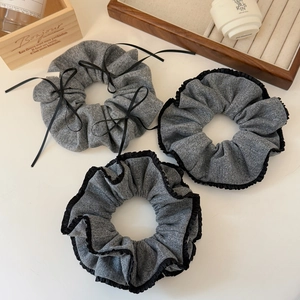 Three-piece set of elegant grey knit hair scrunchies with black lace and ribbon bow details