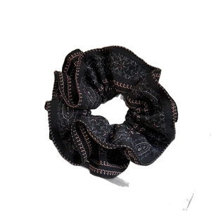 Retro black paisley print scrunchie made of premium fabric for elegant hairstyles