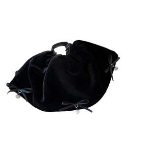 Elegant black velvet claw clip with layered ruffles and three delicate ribbon bows