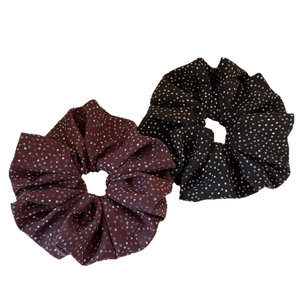 Polka dot hair scrunchies in burgundy and black colors with a puffy minimalist design