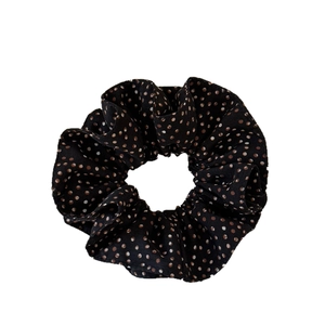 Elegant double-layered polka dot scrunchie in black fabric for chic hair styling