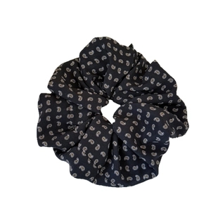 Oversized paisley print scrunchie in black satin fabric for elegant hair styling