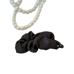 Elegant black satin pleated banana hair clip for women with silky texture and pearl accents