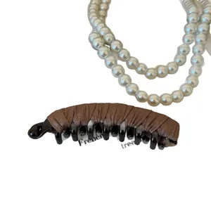Elegant brown satin fabric banana hair clip for ponytail styling on white background
