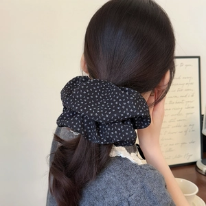Floral print oversized scrunchie for women made of soft black fabric with white flowers