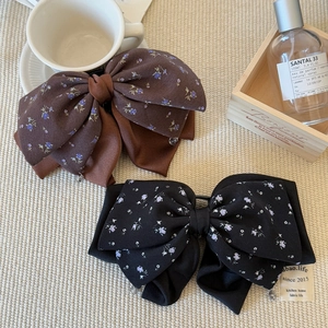 Elegant satin floral bow hair clips with rhinestone pendants in black and brown colors