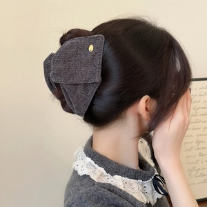 Elegant dark grey velvet bow hair claw clip with metallic sheen for women hair styling