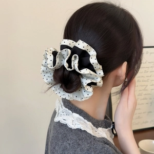 Classic black and white polka dot scrunchie with layered contrast edging for women