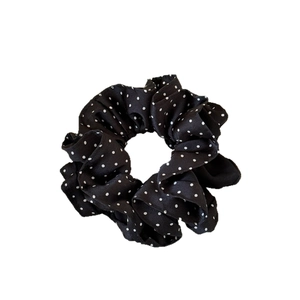 French vintage black satin scrunchie with white polka dots and elegant glossy texture