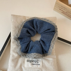 Detailed knit edge on navy blue fabric scrunchie with a Studio Mezo cotton pouch