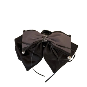 Elegant butterfly ribbon hair claw clip with rhinestones and pearl pendants on white back