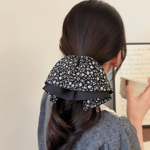 Elegant vintage black and white floral bow hair claw clip for ponytail on back of head