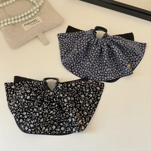 Elegant floral fabric bow hair claws in black and blue patterns for women's hairstyles