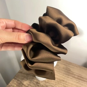 Elegant coffee brown satin oversized pleated shark hair claw clip with a glossy finish