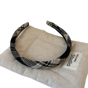 Classic plaid fabric headband with handmade label on premium linen texture base