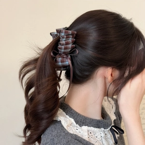 Vintage plaid bow banana clip for high ponytail styling with blue and brown fabric texture