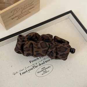Elegant leopard print fabric banana hair clip with pleated texture for stylish ponytails