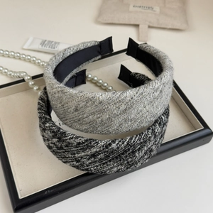 Detail of tweed headband texture with metallic threads and anti-slip lining