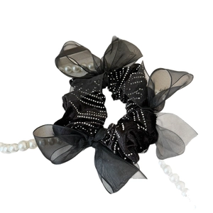 Elegant black velvet scrunchie with silver rhinestones and organza bow accents