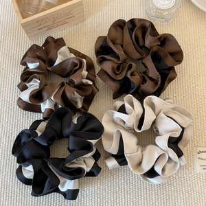 Elegant two-tone satin scrunchies with ruffled edges for stylish women's hair styling
