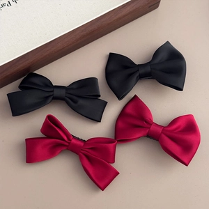 Elegant satin bow hair clips in red and black, holiday festive hair accessories set