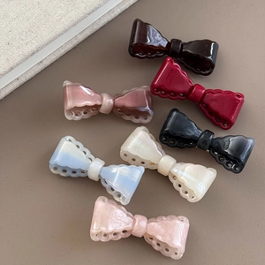 Vintage cutout bow hair clips in seven assorted colors for girls with acetate finish