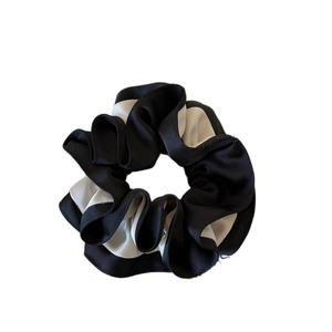 Dual-color ruffle satin scrunchie in black and white silk fabric with high elasticity