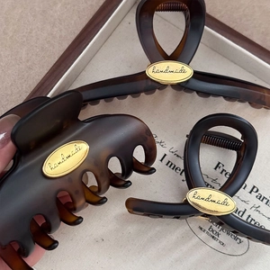 Tortoise shell and matte finish hair claw clips set with golden oval handmade labels
