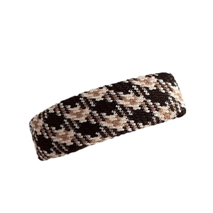 Classic houndstooth fabric hair clip in retro brown and beige tones for autumn