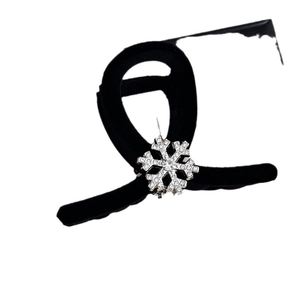 Elegant black velvet hair claw clip with a sparkling rhinestone snowflake ornament