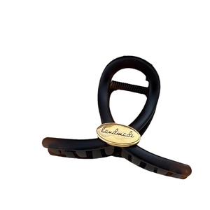 Elegant tortoise shell hair claw clip with golden handmade oval plate for women