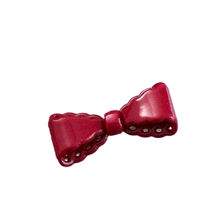 Elegant vintage red bow hair clip for girls featuring hollow edges and glossy finish
