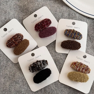 Set aus zehn Herbst-Winter Tweed und Plüsch Haarklammern in verschiedenen Retro-Farben
