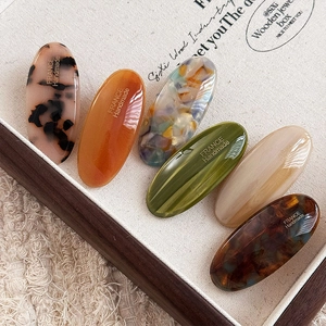 Set of six oval acetate hair clips in vintage tortoiseshell and marble patterns