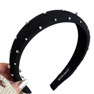 Padded black headband with sparkling silver rhinestones and handmade inner label