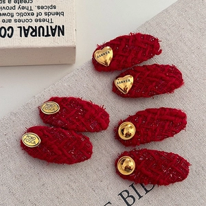 Red tweed hair clips set with gold heart and round charms for autumn winter hair styling