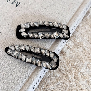Sparkling rhinestone hair clips set with geometric crystals on black metal frames