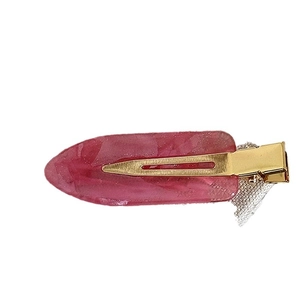 Dreamy pink marble acetate hair clip with delicate white mesh detail on a white background