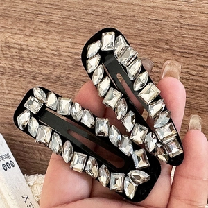 Luxury rhinestone hair clips set with sparkling geometric crystals on a black base